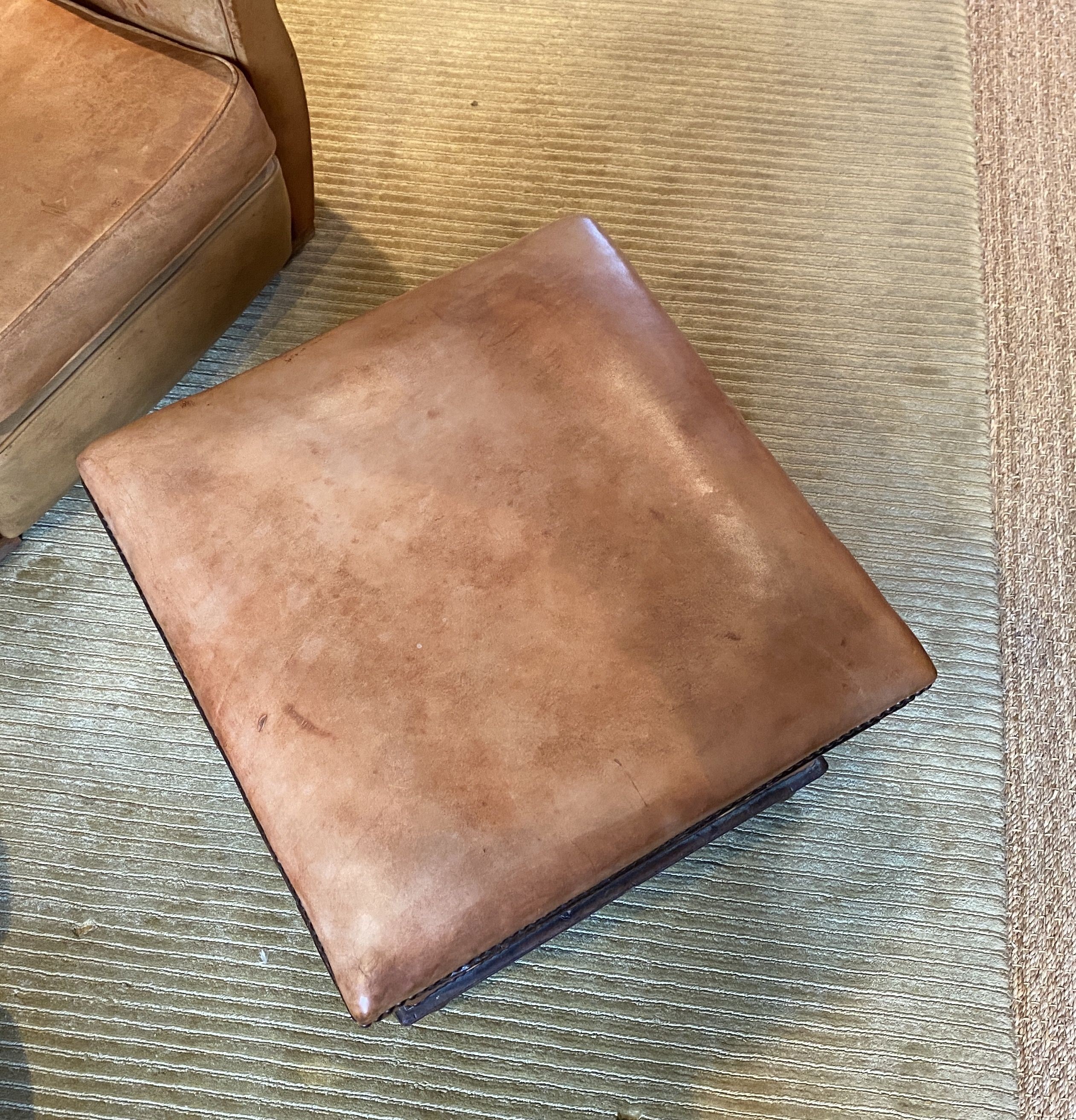 A Victorian mahogany ottoman, later upholstered in pale tan leather, width 57cm depth 55cm height 44cm